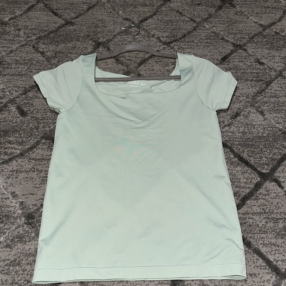 Mint green shirt, buttery soft, bought it a size too big